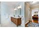 Modern bathroom featuring double vanity, updated fixtures, wood cabinet and decorative mirrors at 1828 Almeta Ne Ave, Atlanta, GA 30307
