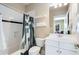 Bathroom with shower and tub combination with updated vanity and modern fixtures at 1828 Almeta Ne Ave, Atlanta, GA 30307