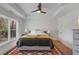 Bedroom featuring natural light, hardwood floors, white walls and a ceiling fan at 1828 Almeta Ne Ave, Atlanta, GA 30307