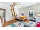 Bedroom featuring a lofted bed, sitting area, windows and hardwood floors at 1828 Almeta Ne Ave, Atlanta, GA 30307
