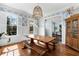 Elegant dining room with hardwood floors, an oversize light fixture, and shuttered windows at 1828 Almeta Ne Ave, Atlanta, GA 30307