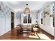 Sun-drenched dining room with hardwood floors, and decorative chandelier at 1828 Almeta Ne Ave, Atlanta, GA 30307