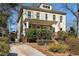 Charming two-story home with a covered front porch, driveway, and well-manicured landscaping at 1828 Almeta Ne Ave, Atlanta, GA 30307