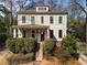 Charming two-story home with a covered front porch and well-manicured landscaping at 1828 Almeta Ne Ave, Atlanta, GA 30307