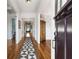 Inviting entry hall with hardwood floors, white wainscotting, and view of the front door at 1828 Almeta Ne Ave, Atlanta, GA 30307