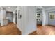 Hallway view leading to the basement, highlighting the home's layout and natural light at 1828 Almeta Ne Ave, Atlanta, GA 30307