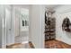 Hallway featuring closet with shelving and drawers leading to a bathroom at 1828 Almeta Ne Ave, Atlanta, GA 30307