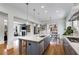 Well-lit kitchen featuring a large island and stainless steel appliances, flowing into a living area at 1828 Almeta Ne Ave, Atlanta, GA 30307