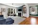 Cozy living room featuring a fireplace, built-in shelving, and hardwood floors at 1828 Almeta Ne Ave, Atlanta, GA 30307