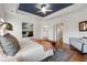 Comfortable main bedroom with a blue tray ceiling, providing a luxurious retreat with ample space and natural light at 1828 Almeta Ne Ave, Atlanta, GA 30307