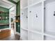 View of custom mudroom with built-in cubbies, hooks, and a glimpse into the home's interior at 1828 Almeta Ne Ave, Atlanta, GA 30307