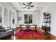 Bright home office featuring white coffered ceilings, large windows, and hardwood floors at 1828 Almeta Ne Ave, Atlanta, GA 30307
