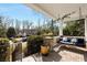 Relaxing porch with a swing, decorative cushions, and a view of the neighborhood at 1828 Almeta Ne Ave, Atlanta, GA 30307
