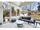 Screened porch with cozy seating area, perfect for enjoying the outdoors while staying protected from the elements at 1828 Almeta Ne Ave, Atlanta, GA 30307