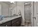 Bathroom with granite counters, ample counter space, and a combined shower and toilet at 212 Long Dr, Mcdonough, GA 30253
