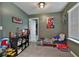 Nicely decorated bedroom showcasing creative wall art and a playful setup by the window at 212 Long Dr, Mcdonough, GA 30253