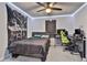 Well decorated bedroom with pop culture themed decor and a modern workspace near the window at 212 Long Dr, Mcdonough, GA 30253