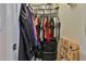 Organized walk-in closet with ample hanging space, shelving, and storage bins at 212 Long Dr, Mcdonough, GA 30253