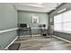 Office space with grey vinyl floors, grey walls, desk, and office chair at 212 Long Dr, Mcdonough, GA 30253