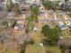 Aerial view of the home highlighting the neighborhood, mature trees, landscaping, and nearby roads at 2696 Titon Way, Lawrenceville, GA 30044