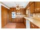 Kitchen with wood cabinets, modern appliances, and ample counter space at 2696 Titon Way, Lawrenceville, GA 30044