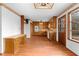 Spacious eat-in kitchen features wooden cabinets and floors plus modern appliances at 2696 Titon Way, Lawrenceville, GA 30044