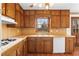 Well-lit kitchen with wood cabinets and stainless steel appliances at 2696 Titon Way, Lawrenceville, GA 30044
