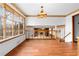 Open living area with hardwood floors and a fireplace with stone surround at 2696 Titon Way, Lawrenceville, GA 30044