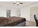 Spacious main bedroom featuring carpeting, a ceiling fan and large windows at 148 White Pine Ln, Temple, GA 30179