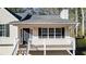 Close up of house with a grey door and windowed porch, trimmed with white railings at 148 White Pine Ln, Temple, GA 30179