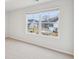 Spacious bedroom with natural light and view of neighborhood through window at 3603 Squires Park Ln, Loganville, GA 30052