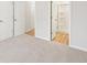Bright bedroom featuring neutral carpeting, trim and paint and a bathroom with a walk in shower at 3603 Squires Park Ln, Loganville, GA 30052