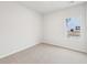 Neutral carpeted bedroom with natural light and window view at 3603 Squires Park Ln, Loganville, GA 30052