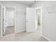 Hallway featuring carpet and doors to other rooms at 3603 Squires Park Ln, Loganville, GA 30052