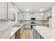 Bright and modern kitchen with granite counters and stainless steel appliances at 3603 Squires Park Ln, Loganville, GA 30052