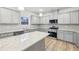 New kitchen with granite countertops, stainless steel appliances, and an island at 3603 Squires Park Ln, Loganville, GA 30052