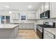Modern kitchen with stainless steel appliances and plenty of counter space at 3603 Squires Park Ln, Loganville, GA 30052