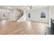 Bright living room featuring hardwood floors, fireplace, and abundant natural light at 3603 Squires Park Ln, Loganville, GA 30052