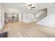 Spacious open concept to a modern kitchen with center island and hardwood flooring at 3603 Squires Park Ln, Loganville, GA 30052