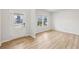 Bright living room featuring wood-look floors, a glass door and plenty of natural light from the windows at 3603 Squires Park Ln, Loganville, GA 30052