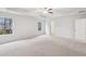 Bright main bedroom features plush carpet, tray ceiling, and natural light at 3603 Squires Park Ln, Loganville, GA 30052