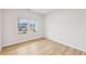 Bright room with light colored floors and large windows with white trim at 3603 Squires Park Ln, Loganville, GA 30052