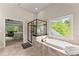 Beautiful bathroom with a modern frameless shower and an extra large soaking tub at 6625 Baywood Run, Cumming, GA 30041