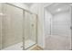 Modern bathroom features tiled walk-in shower with glass door at 1461 Stephens View Dr, Loganville, GA 30052