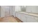 Bathroom with double sinks, granite countertops, and sleek cabinets at 1461 Stephens View Dr, Loganville, GA 30052