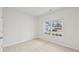 Carpeted bedroom with natural light and a view of the front yard at 1461 Stephens View Dr, Loganville, GA 30052