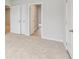 Bedroom with neutral walls, plush carpet flooring, and bi-fold doors leading to a closet at 1461 Stephens View Dr, Loganville, GA 30052