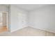 Cozy bedroom with a carpeted floor and closet with double doors at 1461 Stephens View Dr, Loganville, GA 30052