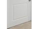 Close-up of a modern white door with a square panel design at 1461 Stephens View Dr, Loganville, GA 30052