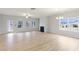 Bright living room featuring a fireplace, large windows, and wood-style floors at 1461 Stephens View Dr, Loganville, GA 30052